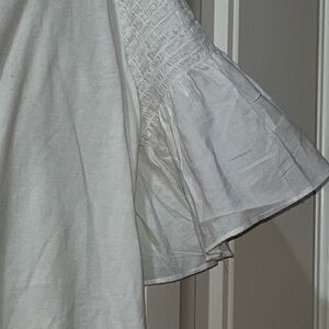 Maette Smocked and Ruffled White T-Shirt Blouse